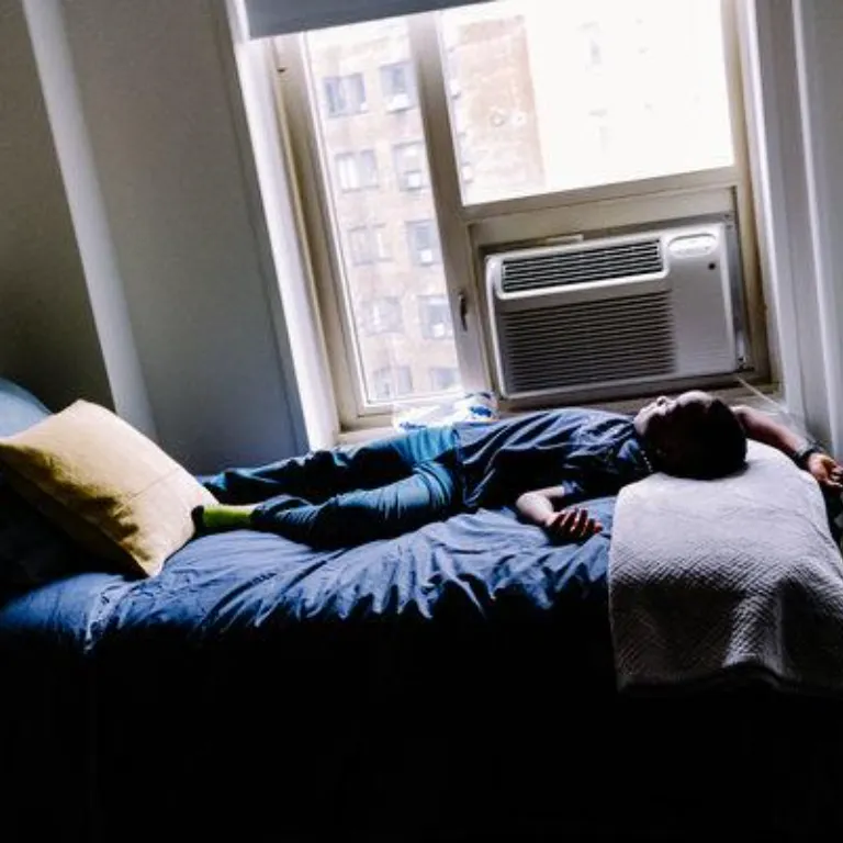 Adewumi Lying On The Bed Of His New Apartment In Manhattan