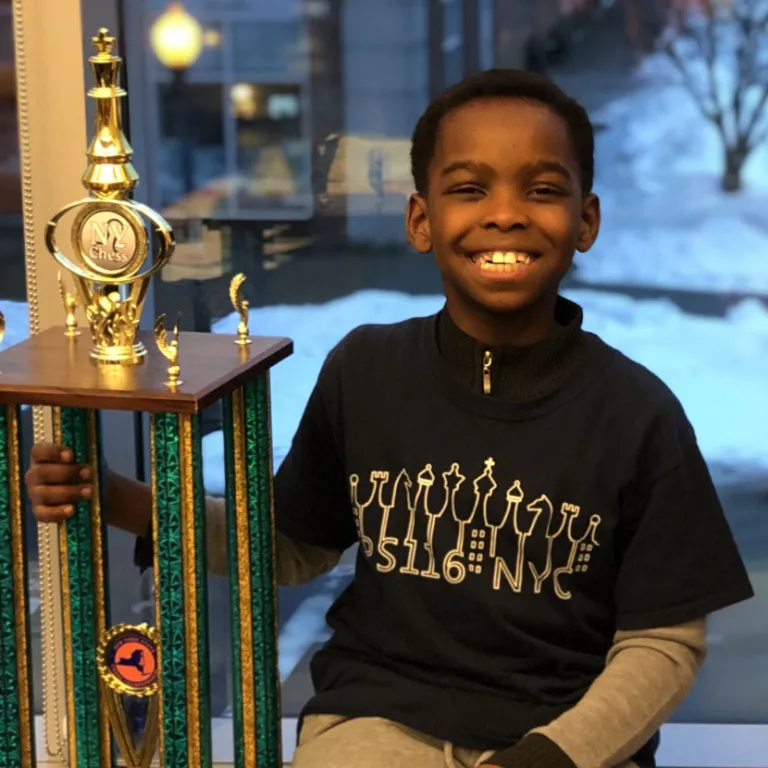 Adewumi With The 2019 K-3 NY State Chess Championship Trophy