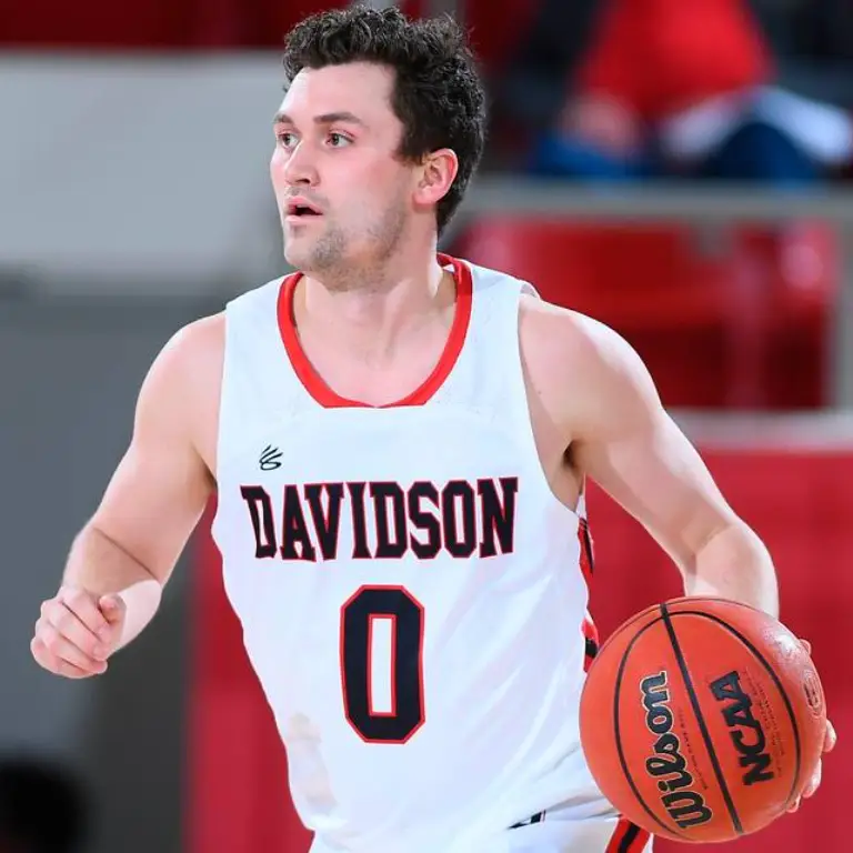 Foster Loyer playing basketball for Davidson College
