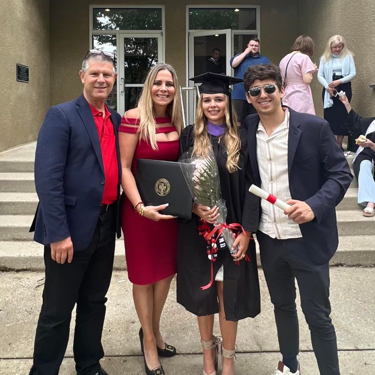 Hernandez's mother, Isabel, and stepfather, Jose, at his sister, Isabella's graduation
