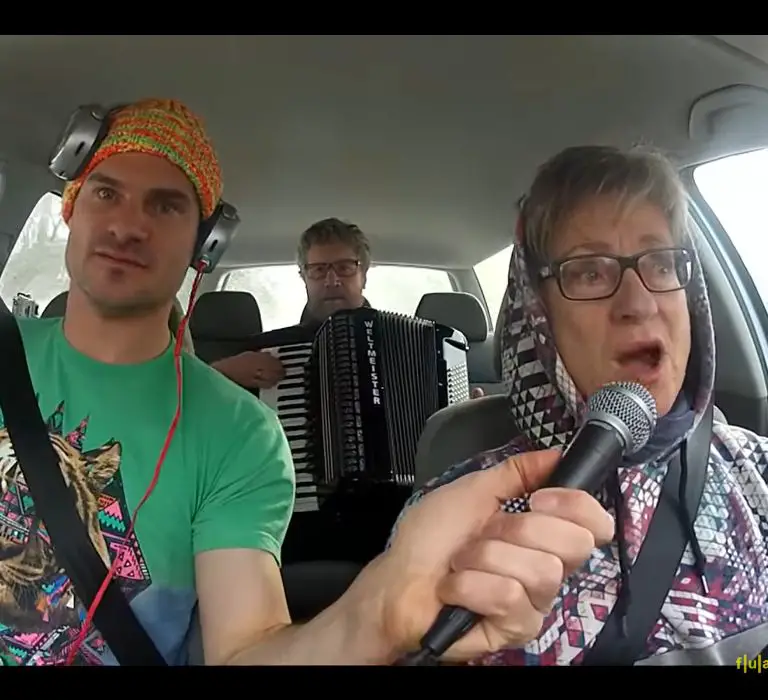 Flula with his father and mother in a carpool karaoke