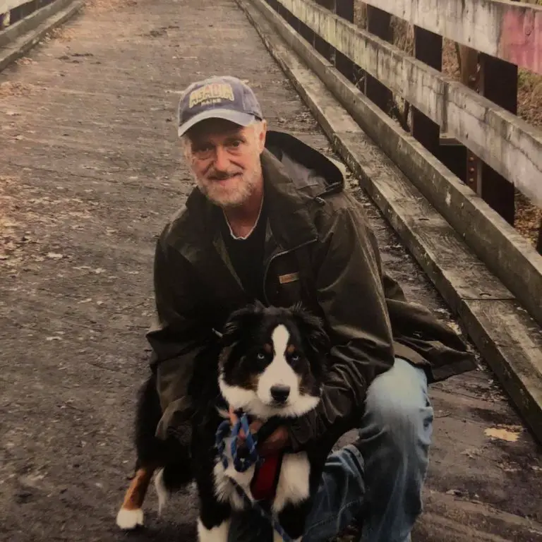 Kariselle Snow's dad, Alex Smith, with a family dog